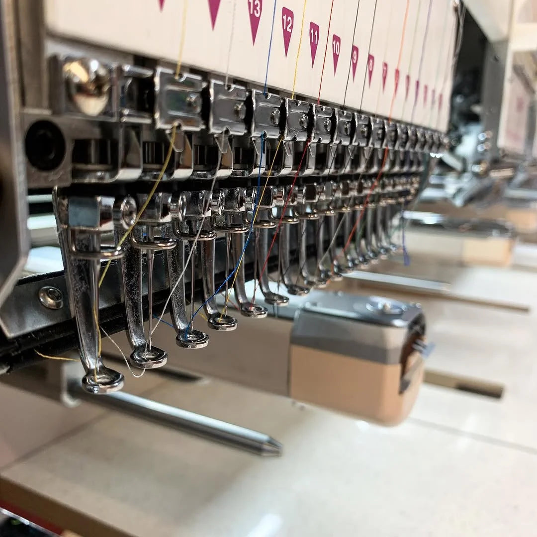 Embroidery machine stitching a custom logo at Express in Cleveland, TN