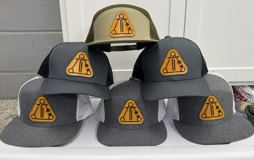 A range of caps embroidered with customer logos by Express Screen Printing in Cleveland, Tennessee